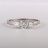 Asscher cut diamond ring with baguettes in platinum