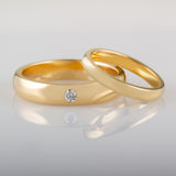 Bride and groom matching wedding ring set in yellow gold