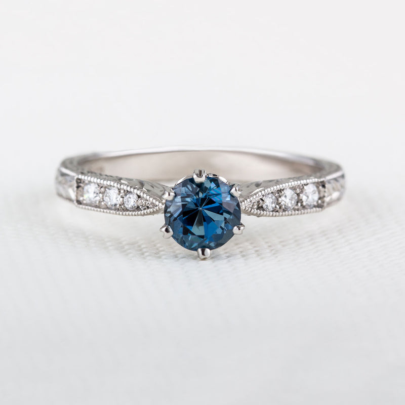 Engraved aquamarine engagement ring with diamond band in platinum