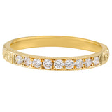 Engraved yellow gold wedding band with diamonds
