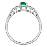 Emerald ring with baguette diamonds in platinum