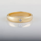Men's yellow gold wedding ring with round diamond