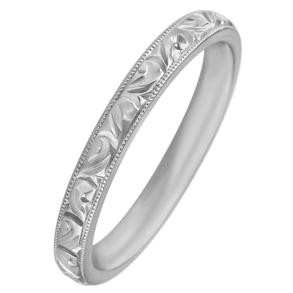 Women's platinum wedding ring with engraved scroll pattern