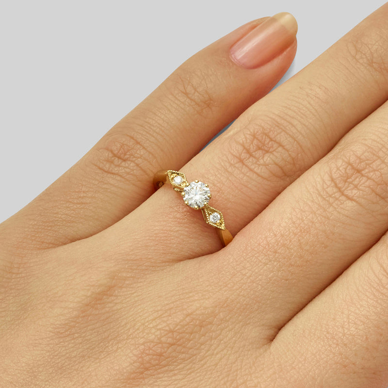 Yellow gold Art Deco engagement ring with round diamond centre