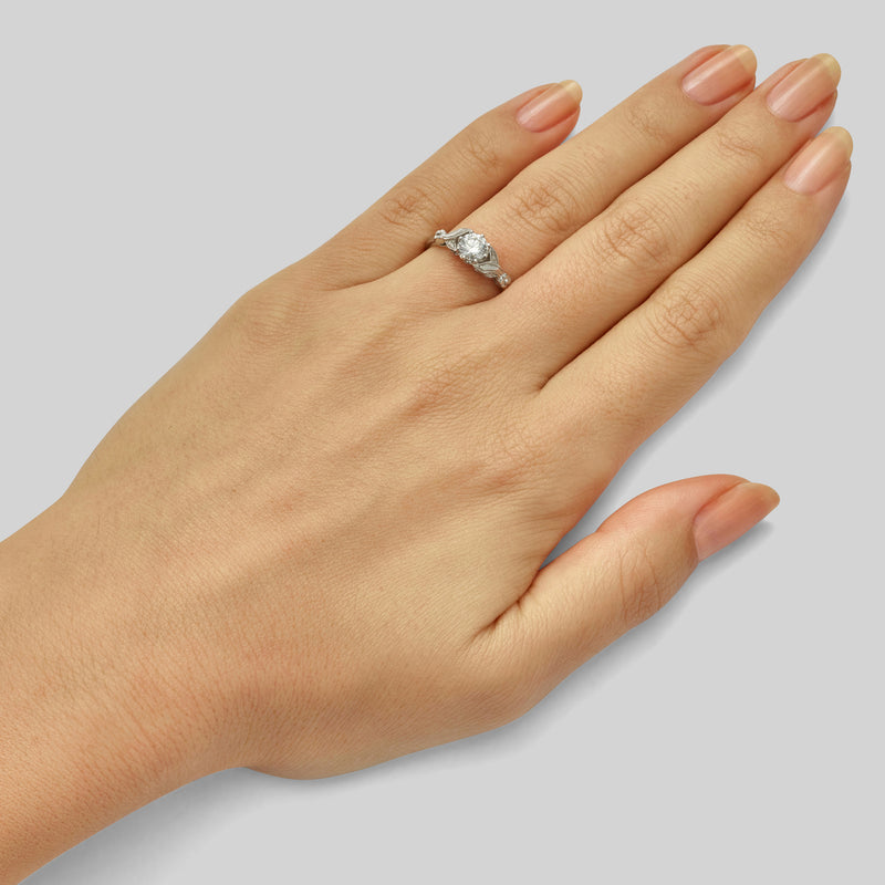 Flower design round diamond engagement ring