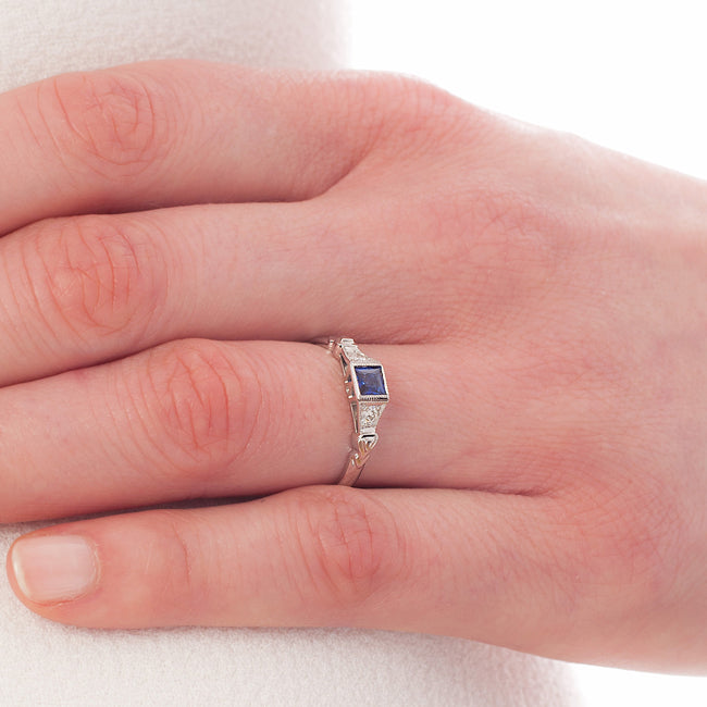 Unusual square sapphire ring on hand