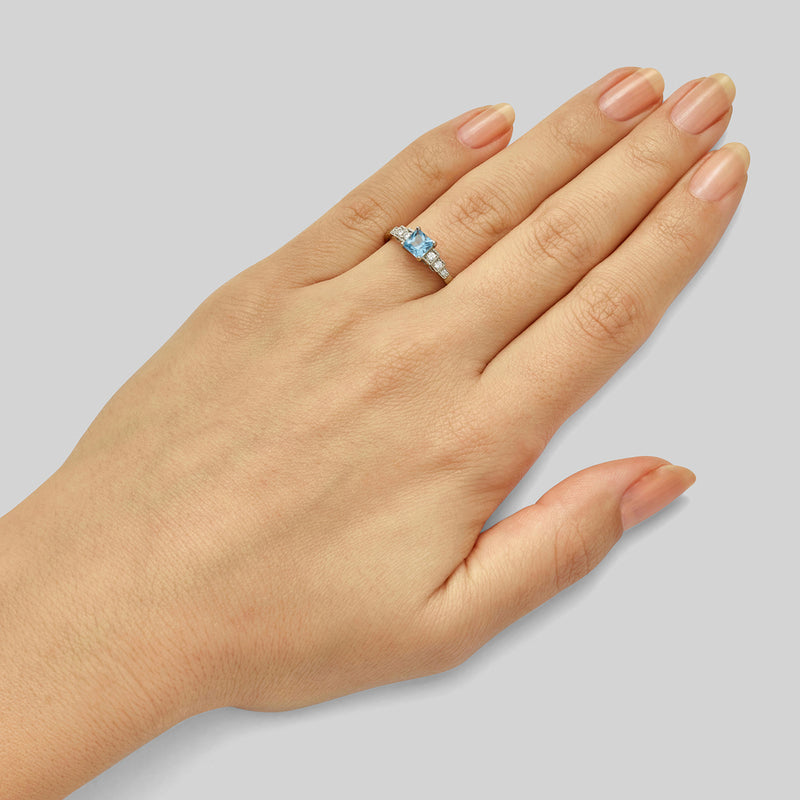 Princess cut aquamarine engagement ring with diamond shoulders