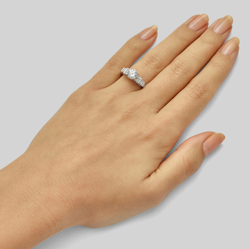 Unique round brilliant cut diamond engagement ring in Art Deco style