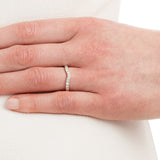 2.5mm curved diamond wedding ring on hand