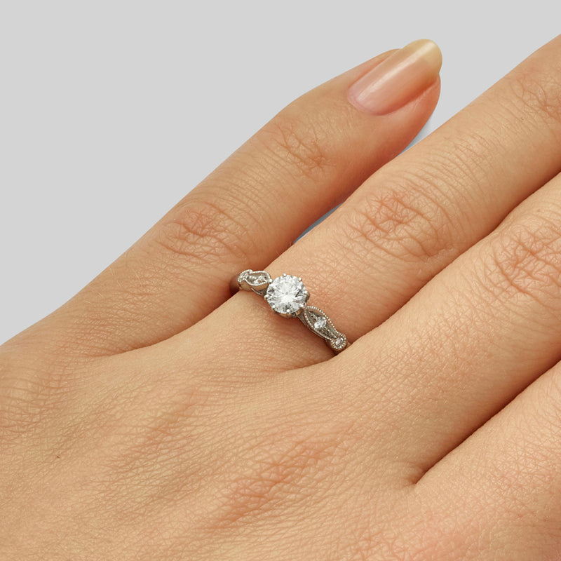Edwardian round cut diamond engagement ring with scalloped-set diamonds