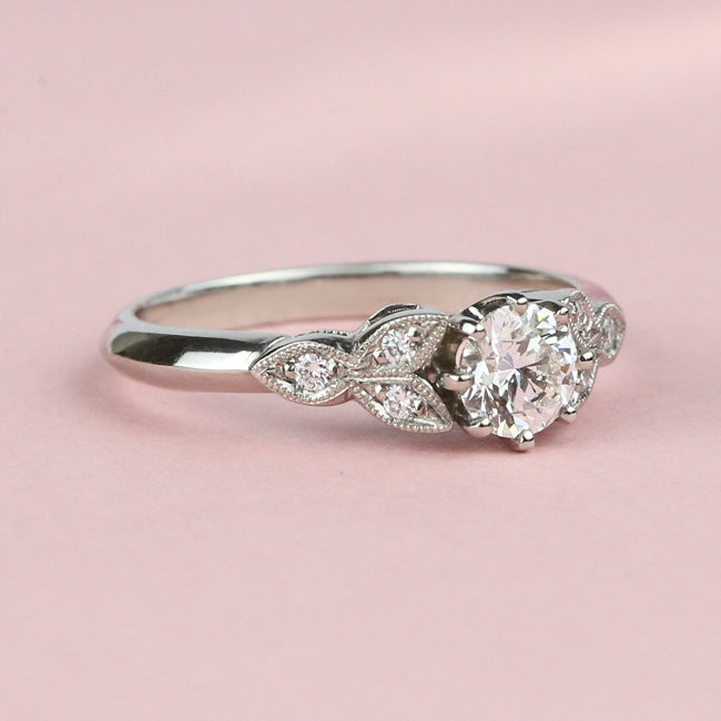 Diamond ring with flower shoulders