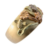 Angle view three tone gold flower ring