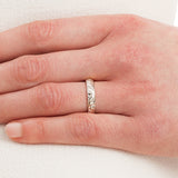 Hand wearing ladies 4mm engraved wedding ring