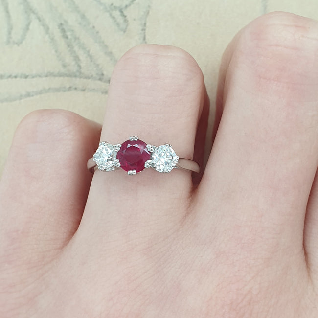 Ruby trilogy ring on hand