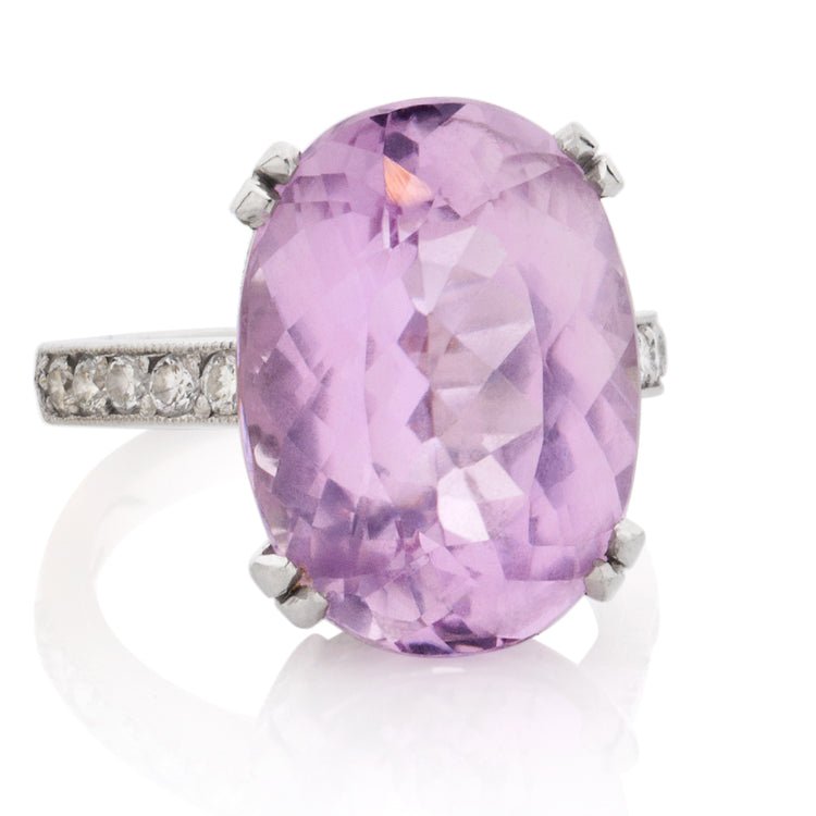 Large oval kunzite and diamond engagement ring