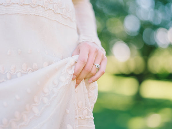 Bride Wearing Antique Inspired Diamond Cluster Ring