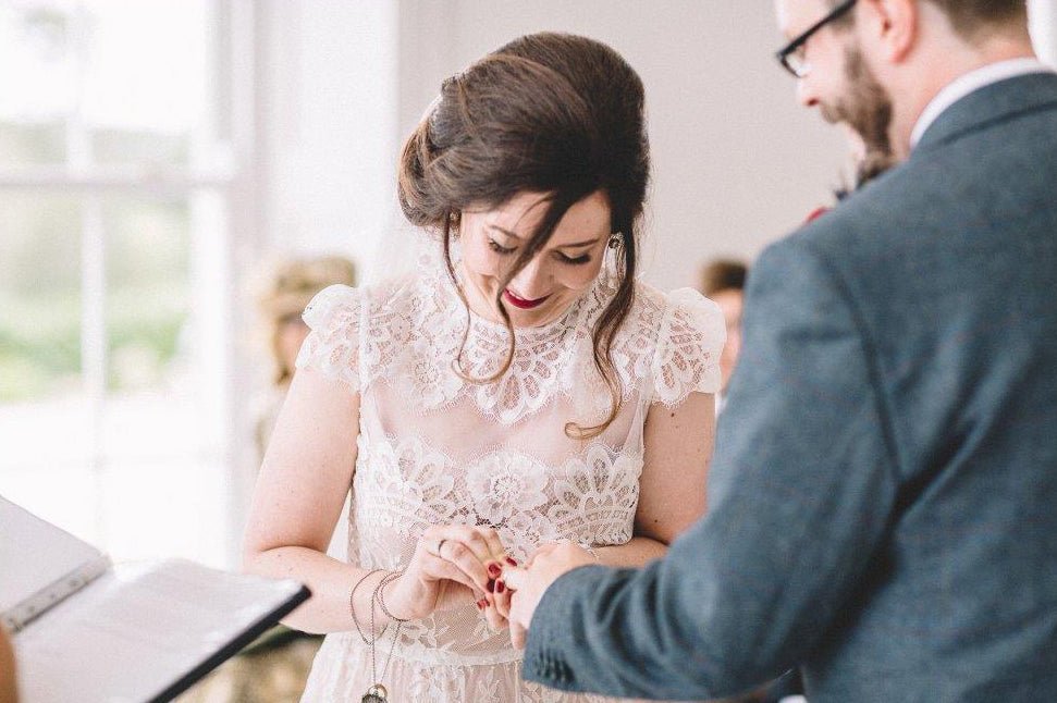 Bride and groom wedding ceremony exchanging the rings