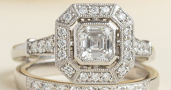 Asscher cut diamond cluster ring with diamond wedding band