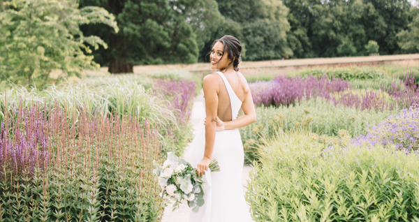 Bride walking in lavender garden