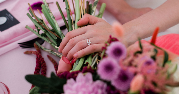 Pink sapphire and diamond engagement ring with diamond twist wedding band