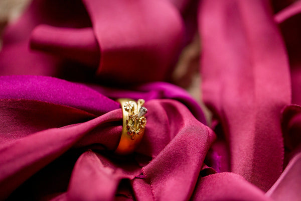 Unusual yellow gold wedding ring with floral bouquet pattern
