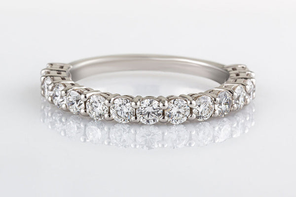 Round diamond eternity or wedding ring in white gold claw set