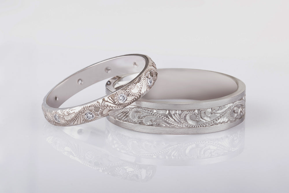 Platinum wedding ring set with paisley engraving