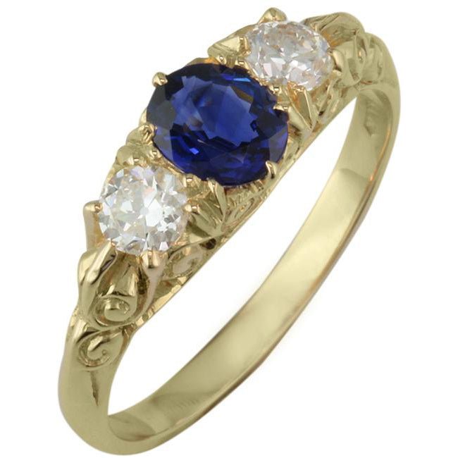 Sapphire diamond ring in antique carved half hoop design.