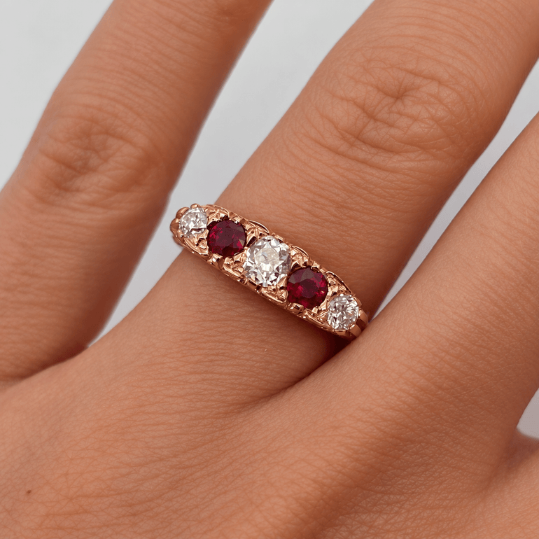 diamond and ruby rose gold victorian vintage style half hoop engagement ring on hand