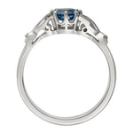Aquamarine with leaf shoulder engagement ring in platinum. Made in London