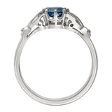 Aquamarine with leaf shoulder engagement ring in platinum. Made in London