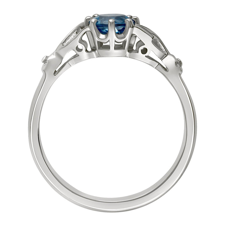 Aquamarine with leaf shoulder engagement ring in platinum. Made in London