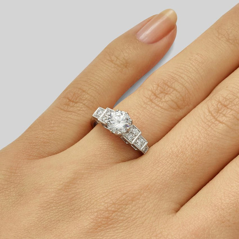 Art Deco large round diamond ring with side stones