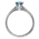 blue gemstone ring with floral pattern 