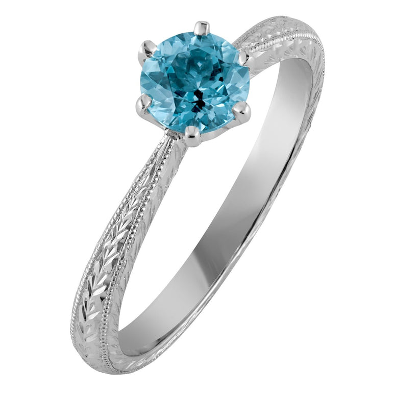 aquamarine engagement ring in platinum engraved in floral and vintage style