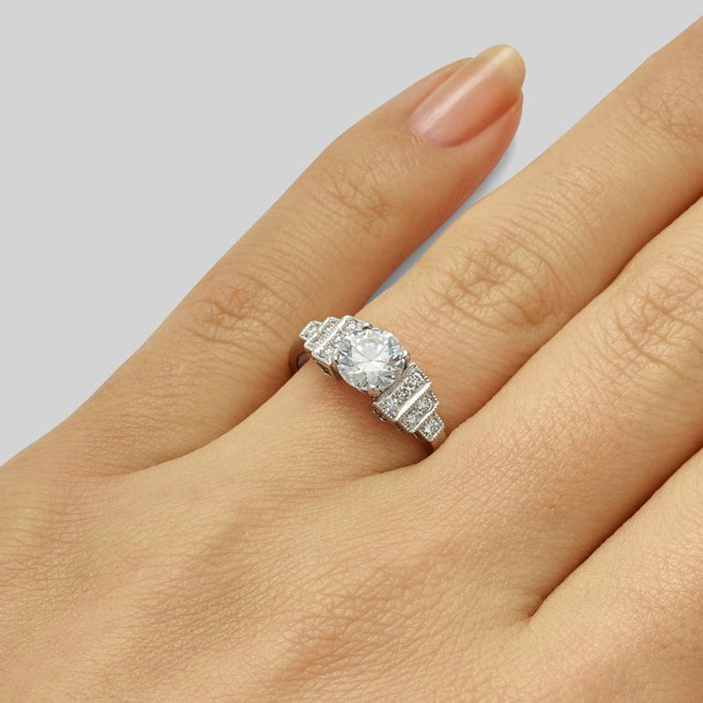 Art Deco round diamond engagement ring with diamond accents