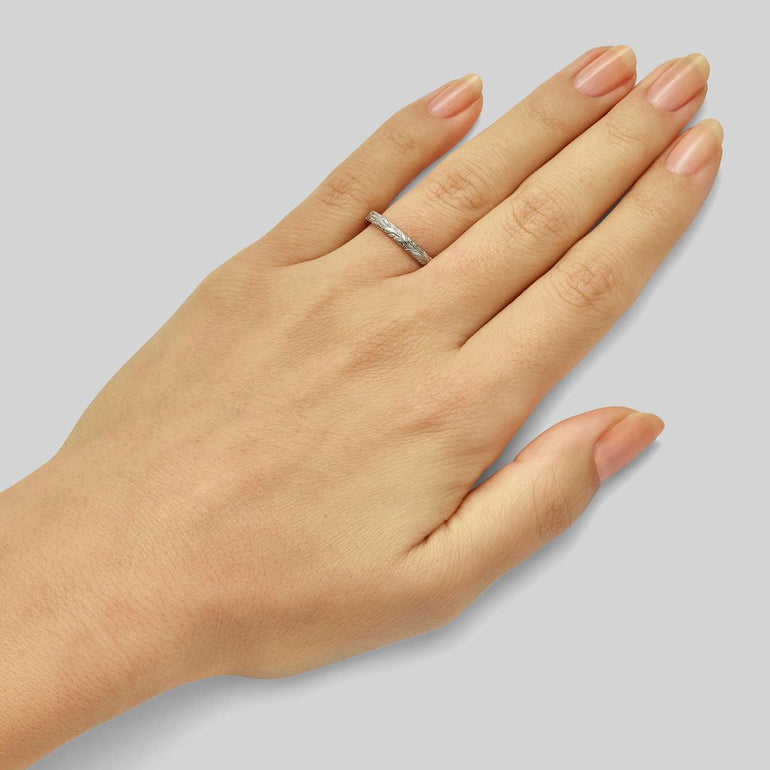 Floral engraved platinum wedding band