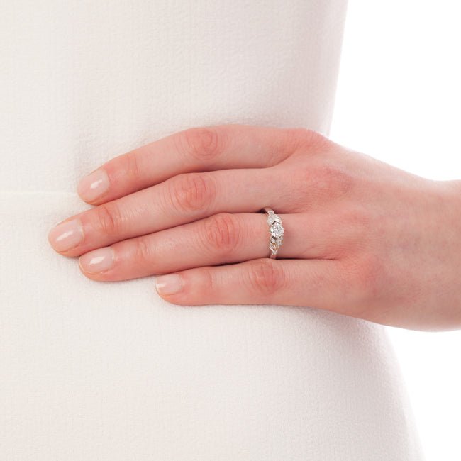 Model wearing floral vintage ring in platinum