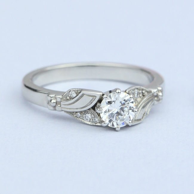 Unusual flower diamond engagement ring on paper