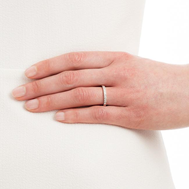 Model wearing diamond wedding band in UK