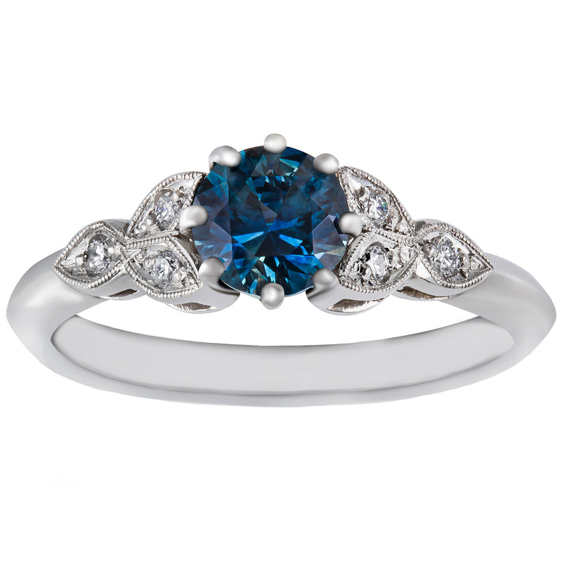 Teal sapphire engagement ring in platinum
