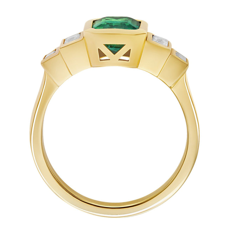 Emerald cut emerald with baguette diamonds and 18ct yellow gold band.