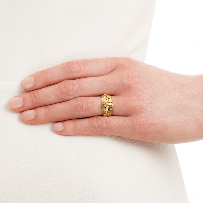 Lily and bee ring on hand