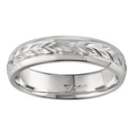 Hand engraved floral wedding band in platinum. Made in London