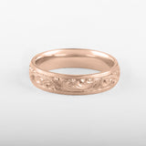 5mm rose gold mens wedding band in paisley pattern on paper