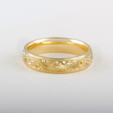 5mm yellow gold wedding ring in paisley engraving on paper