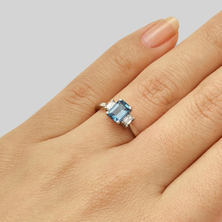 Vintage emerald cut aquamarine engagement ring with diamonds