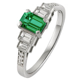 Emerald engagement ring with baguette diamonds in Platinum made by Hatton Garden Jeweller