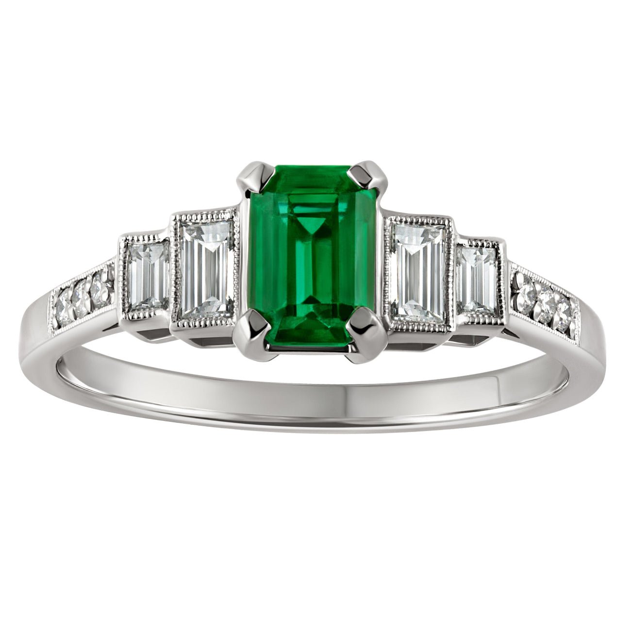 Emerald gemstone and diamond accents on a white background made in London.