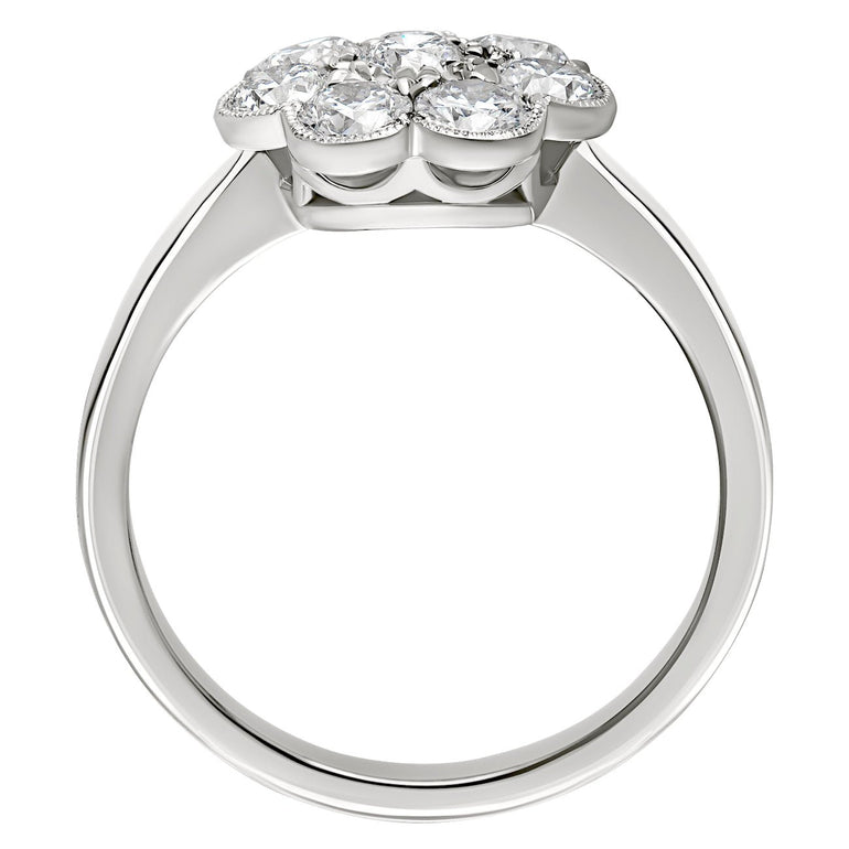 Vintage inspired cluster ring with diamonds in platinum. Made in London